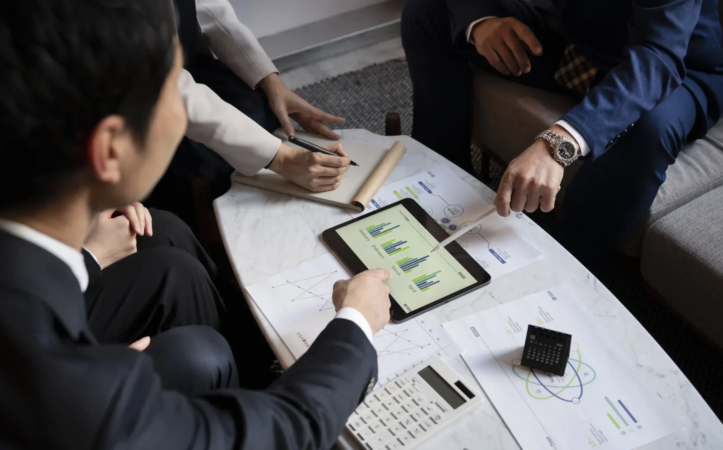 business-people-working-with-ipad-high-angle