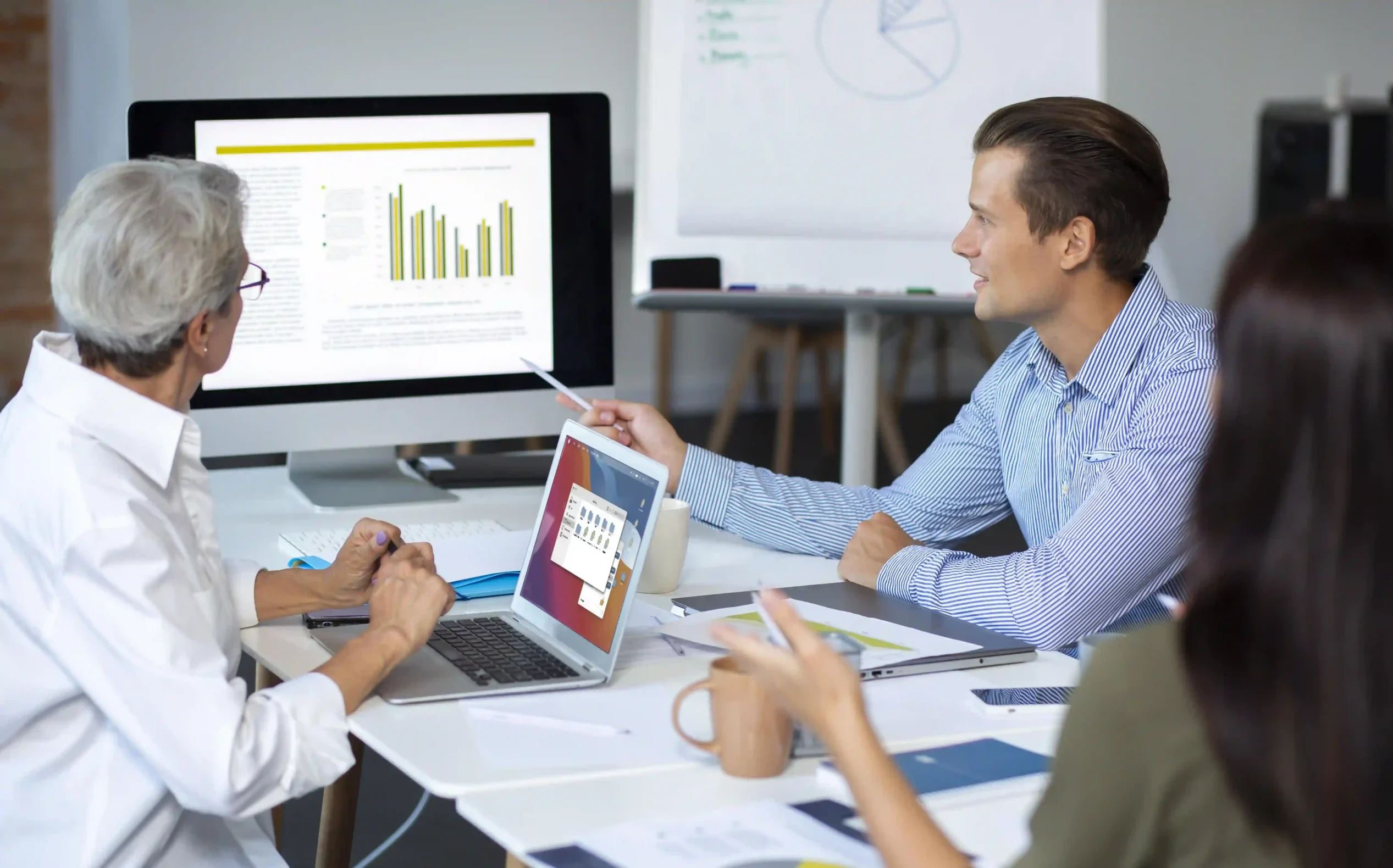 people-using-digital-device-while-meeting